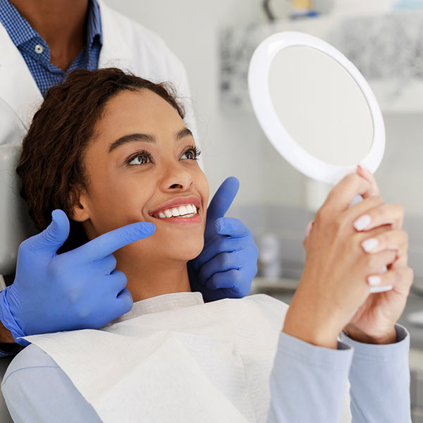 woman looking at her new white smile